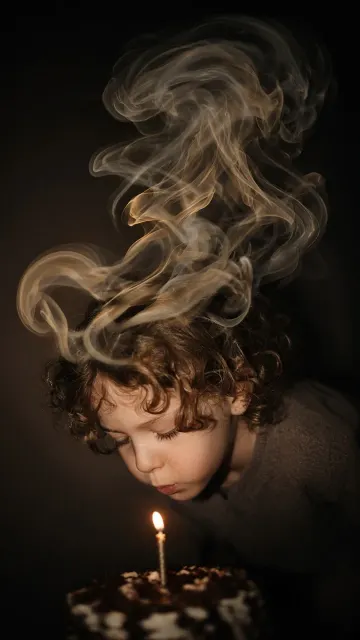 Fine Art Photography image example: Slow Sync Flash Child Blowing Birthday Candle Photography