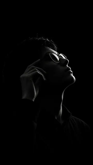Black and White Silhouette Adjusting Glasses Portrait