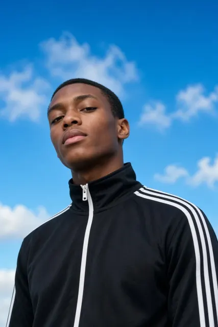 Black Tracksuit Blue Sky Photo AI Prompt