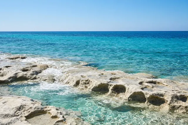 Translucent Mediterranean Micro-Surf over Limestone Shelf