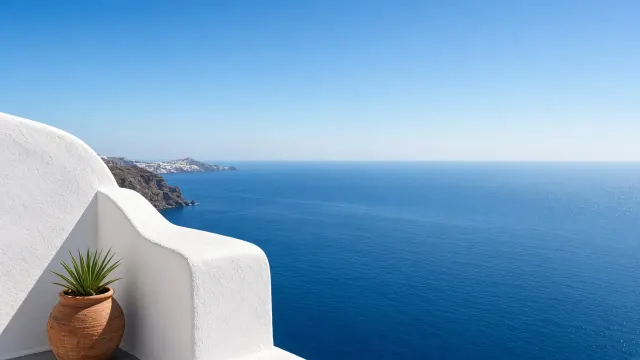 Santorini Caldera Whitewashed Terrace Over Aegean Blue