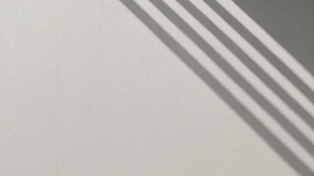 Minimalist Architectural Concrete Wall with Morning Geometric Shadows