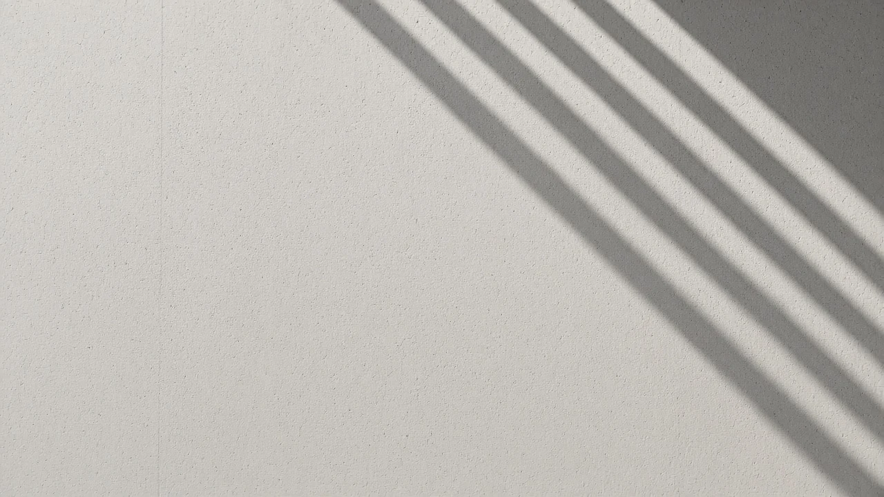 Minimalist Architectural Concrete Wall with Morning Geometric Shadows