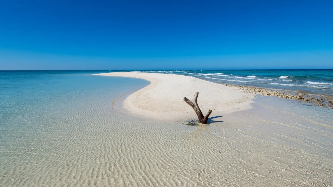 Curved White Sandbar Spit Enclosing Shallow Azure Basin at Low Tide