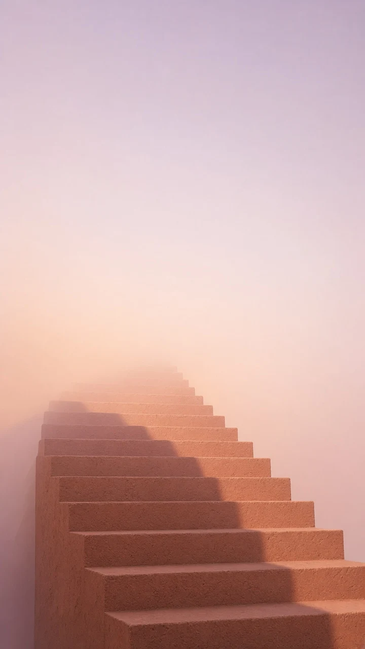 Minimalist Terracotta Stairway Reaching into Peach Morning Mist