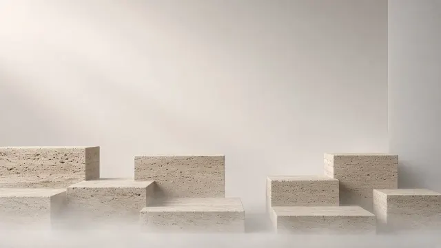Monolithic Travertine and Micro-Cement Architectural Plinths in Mist