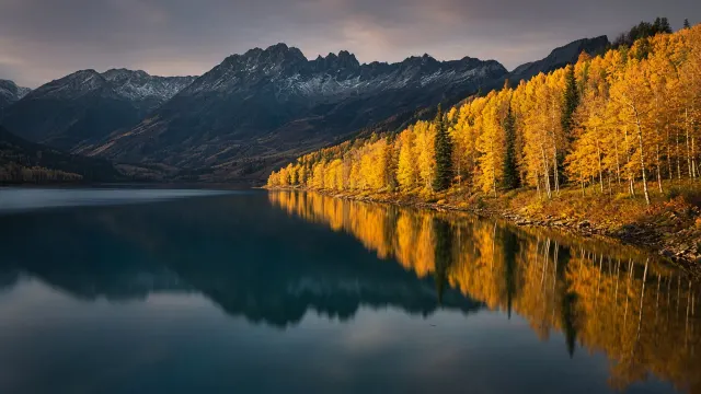 Mirror Lake Reflecting Golden Autumn Hills at Dusk