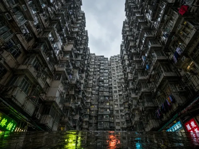 Vertiginous Residential High-Rise Canyon After Heavy Rain