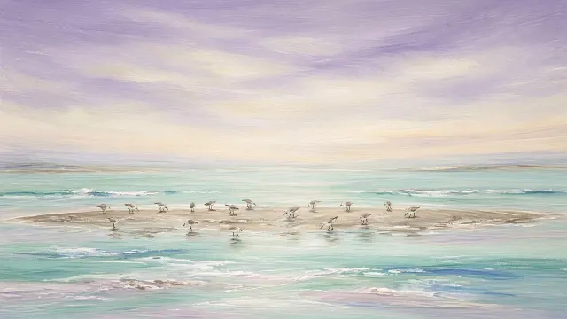 Pale Sandbar and Wading Shorebirds Under Expansive Lavender Sky
