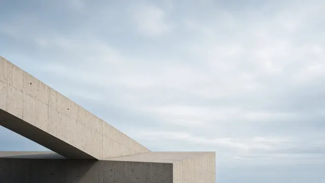Sunlit Brutalist Architecture Shadow Play on Fluted Concrete