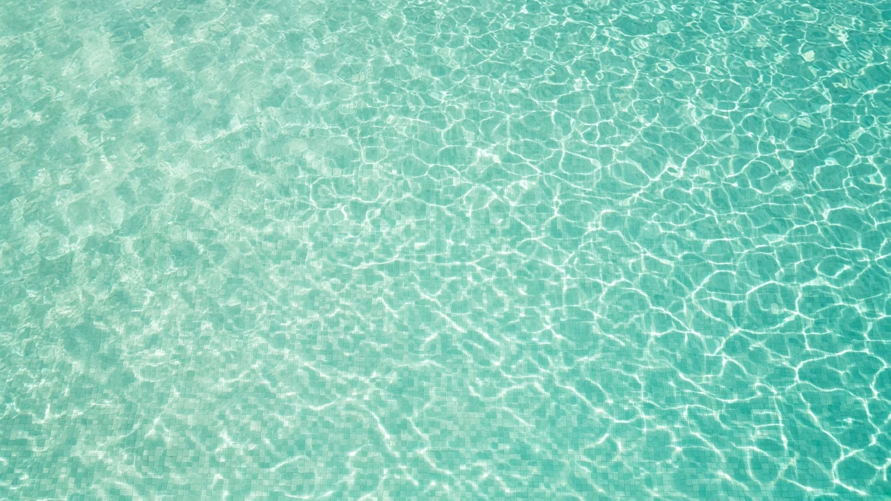 Overhead Serene Swimming Pool Water Ripple Texture