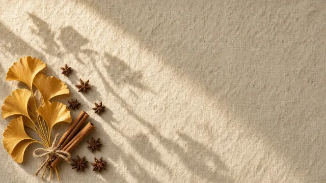 Minimalist Linen Flat Lay with Gilded Ginkgo Biloba Leaves and Cinnamon