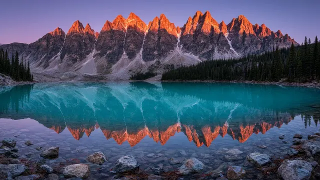 Glacial Alpenglow Mirroring Moraine Spires at Moraine Lake Dawn