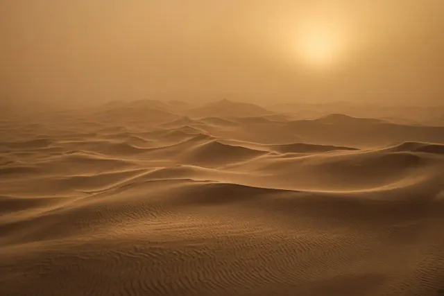 Taklamakan Shifting Sand Sea in Post-Storm Suspended Dust Glow