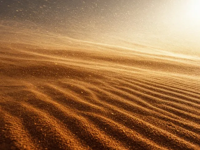 Dynamic Ground-Level Sand Drift Ribbons Dancing Across Ridges