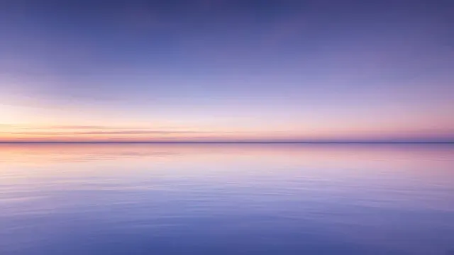 Nautical Twilight Horizon over Mirror-Calm Open Ocean
