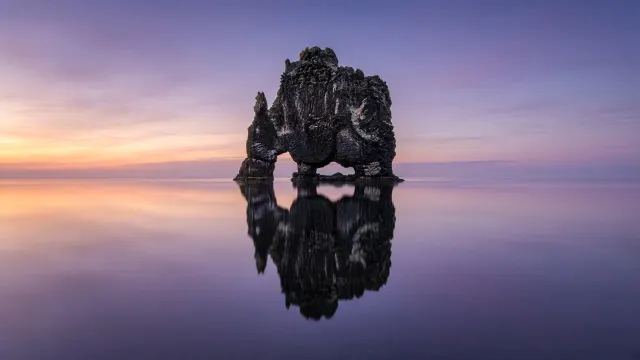 Basalt Sea Stack Standing Sentry in Still Twilight Water