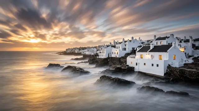 Ethereal Long Exposure of Breakers Beside White Sea Walls