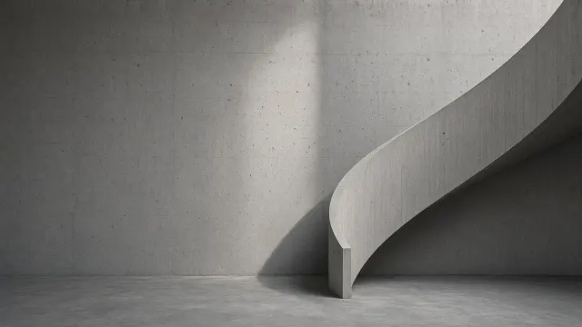 Brutalist Concrete Spiral Staircase with Sculptural Sunlight