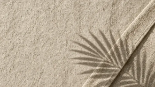 Folded Natural Linen with Palm Frond Shadow Play on Off-White Canvas