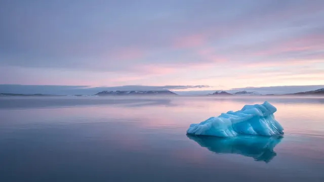 Glacial Lagoon Iceberg Fragment under Serene Polar Dawn Glow