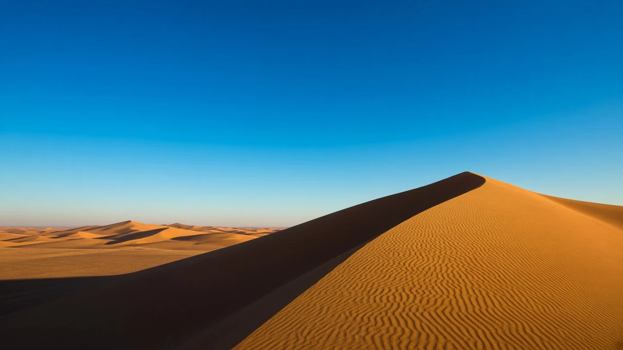 Sculpted Desert Sand Ridge with Clean Cerulean Sky