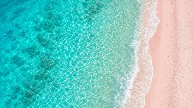 Aerial Coral Sand Shoreline with Crystalline Turquoise Water